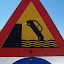 Please wait for ferry before driving car off ramp.