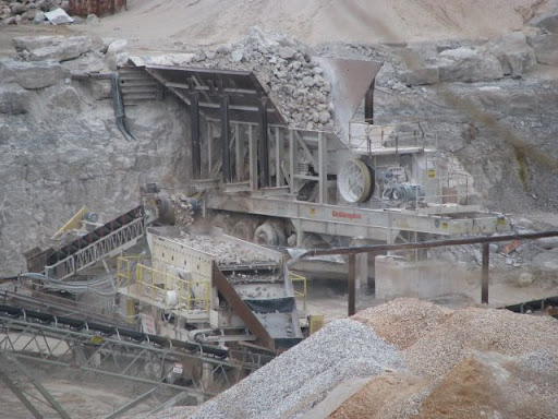 Huge limestone boulders are crushed into smaller pieces at the Journagan Construction quarry.