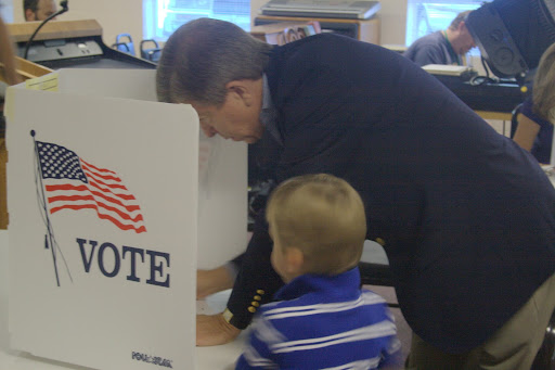 Roy Blunt fills out his Ballot as young Charlie watches on. (Photo by: Kenrick Nobles)