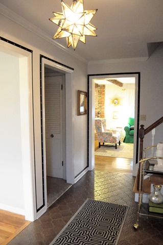 grosgrain ribbon and upholstery tacks around doorways