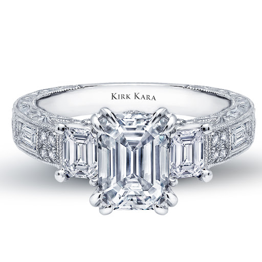 From the Charlotte Collection, the Emerald cut center stone join hand-engraved details and emerald cut baguettes for a romantic yet modern look. engagement ring from the Kirk Kara Charlotte collectio From the Charlotte Collection, the Emerald cut center stone join hand-engraved details and emerald cut baguettes for a romantic yet modern look. engagement ring from the Kirk Kara Charlotte collectio