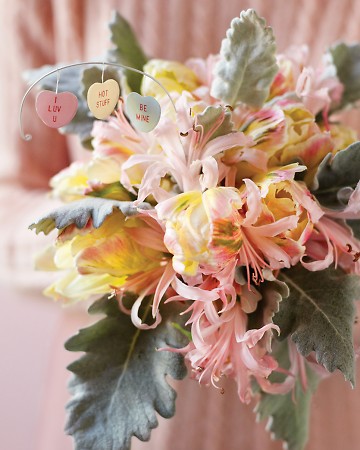 Paper conversation hearts, string, a bit of wire and the bouquet of your choice are all it takes to create this sweet arrangement. Paper conversation hearts, string, a bit of wire and the bouquet of your choice are all it takes to create this sweet arrangement.