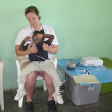 One of our students gets a breathing treatment with Pam to help