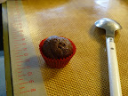 Use a spoon to scoop out the chocolate mixture, then roll and shape the truffles
