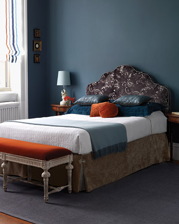 Orange looks great with blue. The bedroom in this picture is cool and sophisticated. The orange ribbon trim on the roman shade as well as the orange velvet pillows and bench upholstery keep the room from appearing gloomy and unfriendly. Orange looks great with blue. The bedroom in this picture is cool and sophisticated. The orange ribbon trim on the roman shade as well as the orange velvet pillows and bench upholstery keep the room from appearing gloomy and unfriendly.