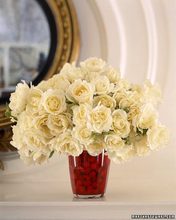 Fill a glass vase with cranberries for a festive touch at the holiday table. Fill a glass vase with cranberries for a festive touch at the holiday table.