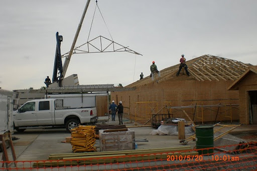 Volunteers set the trusses of the Kingdom Hall. (Photo by Art Morris)