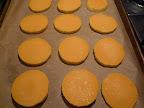 Slices of peeled butternut squash waiting for a drizzle of olive oil, and a sprinkling of salt, pepper, and sage.