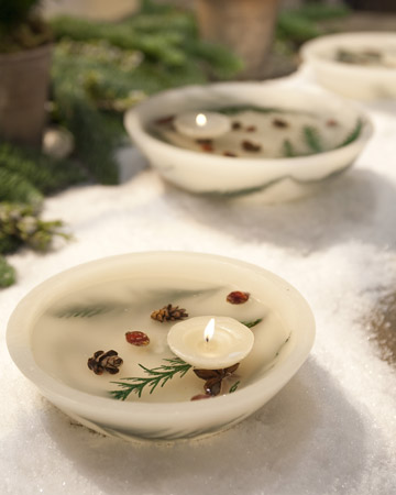 Complete any table setting with a stunning wax bowl centerpiece filled with floating candles, mini pinecones, and dried greenery. Complete any table setting with a stunning wax bowl centerpiece filled with floating candles, mini pinecones, and dried greenery.