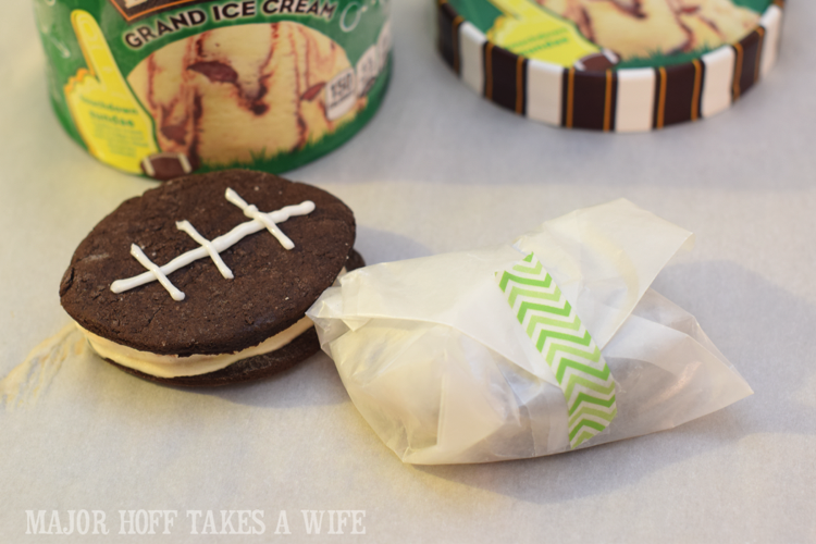 Wrap an ice cream sandwich for storage. Looking for a fun party for your teenage boy? Why not throw a Football video game party? Easy ideas for how to entertain kiddos during the Big Game. Features DiGiorno pizza, personalized football cups, free printable lanyards, and an incredible recipe for football shaped ice cream sandwiches! #GameTimeMVP #CollectiveBias #ad Wrap an ice cream sandwich for storage. Looking for a fun party for your teenage boy? Why not throw a Football video game party? Easy ideas for how to entertain kiddos during the Big Game. Features DiGiorno pizza, personalized football cups, free printable lanyards, and an incredible recipe for football shaped ice cream sandwiches! #GameTimeMVP #CollectiveBias #ad