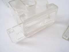 Transparent salt and pepper shakers made in the shape of the letters “S” and “P”