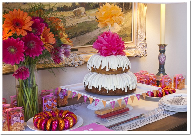 Pink and Orange Birthday Cake and Favors Table