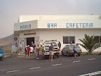 People in front of cafe People in front of cafe