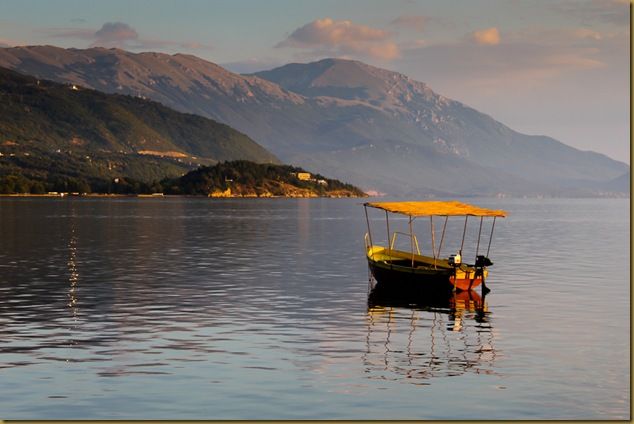 Boat floating on Lake Ohrid at dusk