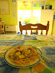 White sauce spaghetti with mixed vege and mussel. In a cozy cottage.