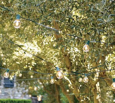 The right lighting adds a special and festive touch to an outdoor space. Strung from trees around the backyard or over the bar, these hanging lights remind me of old-time italian cafes.
(potterybarn.com) The right lighting adds a special and festive touch to an outdoor space. Strung from trees around the backyard or over the bar, these hanging lights remind me of old-time italian cafes.
(potterybarn.com)
