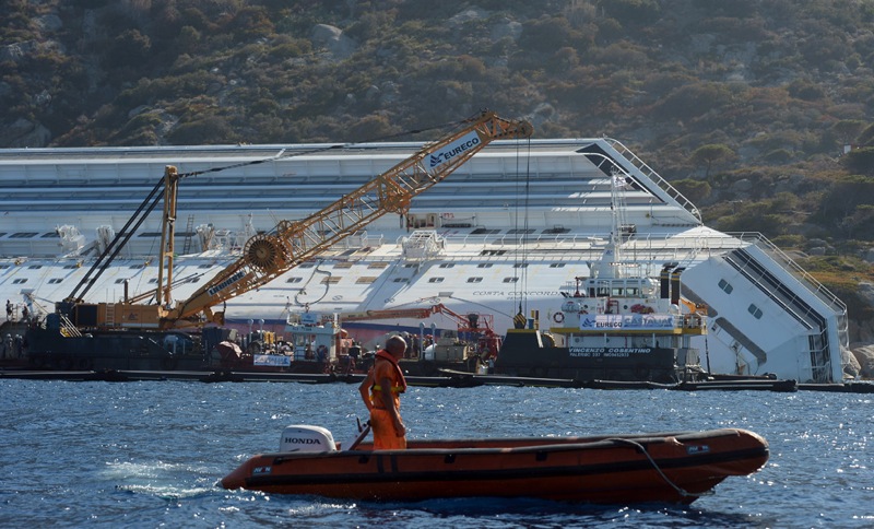 Salvage members work after removing a pi