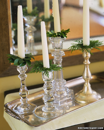 This is the simplest way to add greenery to any room. Tuck greenery into your candlesticks and use it as bobeches, those little glass collars meant to catch dripping candle wax. This is the simplest way to add greenery to any room. Tuck greenery into your candlesticks and use it as bobeches, those little glass collars meant to catch dripping candle wax.