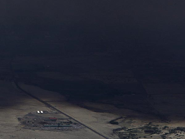 Smoke from the Wallow Wildfire seems to swallow the sky above a farm near Springerville, Arizona, on 7 June 2011. By Ross D. Franklin / AP