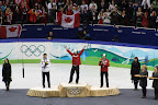 Charles Hamelin on the gold medal podium