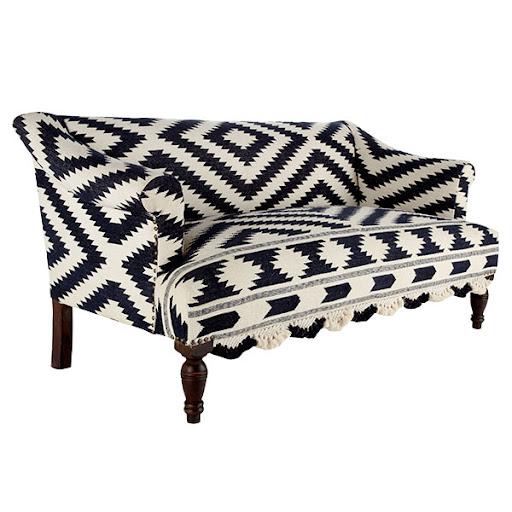 This settee is upholstered with a 