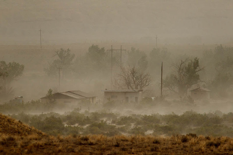A dust storm blows through the lonely town of Woodside, Utah.