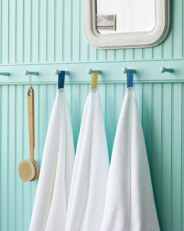 Your family and guests won't confuse their white towels if you color-code them with hanging loops. Your family and guests won't confuse their white towels if you color-code them with hanging loops.