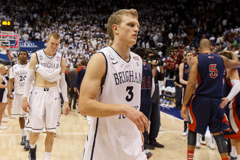 BYU guard Tyler Haws (3) and BYU forward Nate Austin (33) walk off the court after Saint Mary's guard Matthew Dellavedova (4) hit a last-second shot to win the game. BYU hosts Saint Mary's, college basketball Wednesday January 16, 2013 in Provo