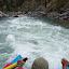 Michelle at the helm in some whitewater