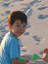 Kai on the beach with charcoal on his nose Kai on the beach with charcoal on his nose