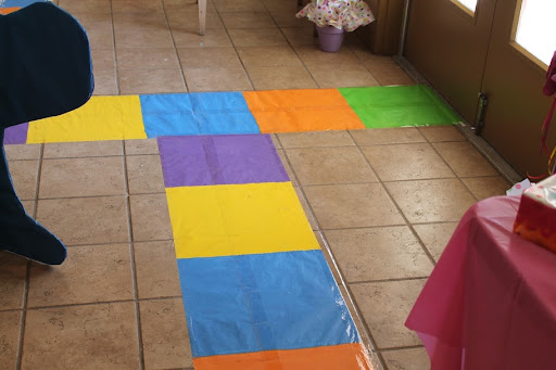  paper taped to the floor led guests to the different areas of Candy Land