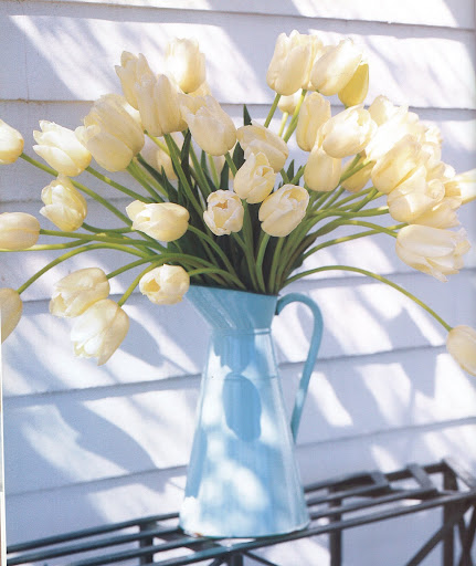 Clean white tulips spill from an agateware wash pitcher. (The Best of Martha Stewart Living -- Arranging Flowers) Clean white tulips spill from an agateware wash pitcher. (The Best of Martha Stewart Living -- Arranging Flowers)