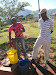All workers at HCPs are volunteers; they do receive meals for their efforts, but little more. Here are two volunteers pumping water at Lobamba NCP.