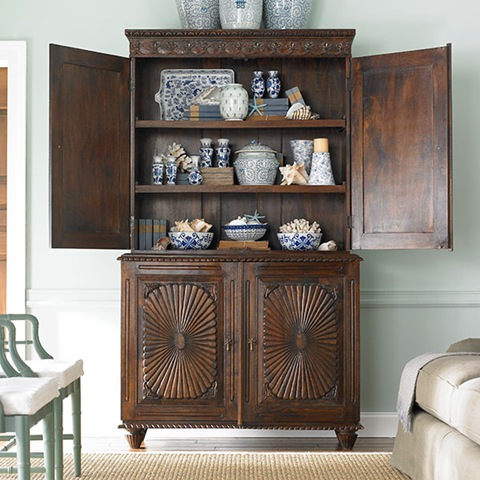 cabinet filled with blue and white porcelain accessories