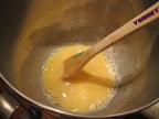 Heating the whole eggs and sugar in (not over) a pan of simmering water until they reach 160F (which happened faster than I expected!). Heating the whole eggs and sugar in (not over) a pan of simmering water until they reach 160F (which happened faster than I expected!).