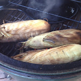 Corn is roasting over indirect heat