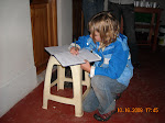 Isabella signs the register on openning day at the interpretation center in Huembo, Peru.