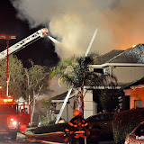 We are presently in process of followup on this incident. Our initial understanding is that this blaze was caused by expended "Safe & Sane" fireworks discarded in the trash can between the two homes. This is currently unverified.
As you use "Safe & Sane" fireworks this 4th of July season, please remember to follow the safety instructions. The instructions call for a bucket of water to douse the expended devices in. The devices are only as safe as the user. News_100705_ElkGroveDualResidentialFire-PHOTOS