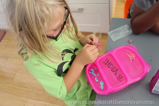 A $9 bento and a $1 cell-phone bling pack = a cheap way to personalize a kid's lunchbox and reduce waste.