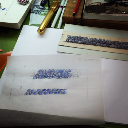 The designer working on this project was sketching out two different bracelet designs using star sapphires, so called for the subtle star pattern that emerges on their surface when a light is shone directly on them. The designer working on this project was sketching out two different bracelet designs using star sapphires, so called for the subtle star pattern that emerges on their surface when a light is shone directly on them.