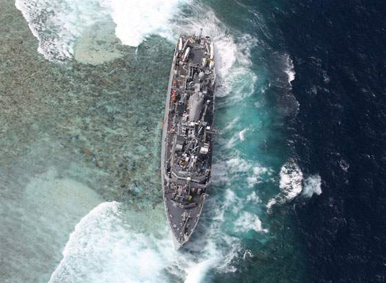 Aerial view of the US Navy ship USS Guardian aground on the Tubbataha Reef, western Philippines, on 19 January 2013. Photo: Armed Forces of the Philippines Western Command (AFP-WESCOM)