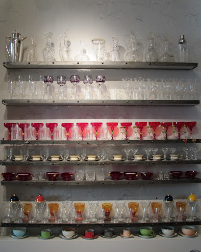 This wall of glasses and teacups is very pretty.