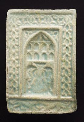 Tile | Origin: Greater Iran or Turkey | Period: second half of 13th to 14th century | Collection: The Madina Collection of Islamic Art, gift of Camilla Chandler Frost (M.2002.1.223) | Type: Ceramic; Architectural element, Fritware, molded, and glazed, 9 1/4 x 6 1/8 in. (23.49 x 15.55 cm)