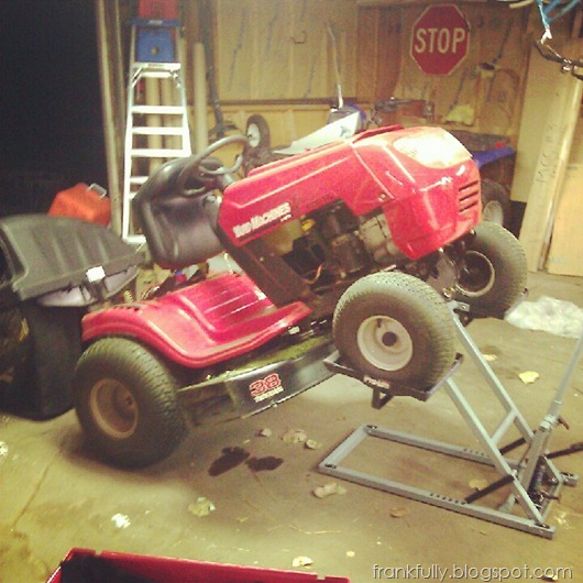 working on the lawn mower