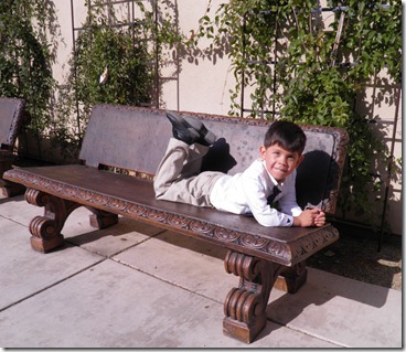 papi on a bench before mass