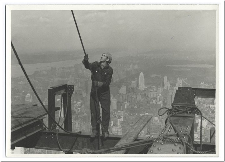 Construction-worker-standing-on-an-I-beam-pulling-a-rope-1931 Construction-worker-standing-on-an-I-beam-pulling-a-rope-1931