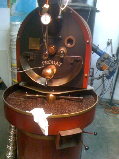 Where the magic happens: this coffee roaster is used to roast all of Oslo's beans. This batch took 15 minutes to roast in the top drum and is now being cooled in the bottom tray. Where the magic happens: this coffee roaster is used to roast all of Oslo's beans. This batch took 15 minutes to roast in the top drum and is now being cooled in the bottom tray.
