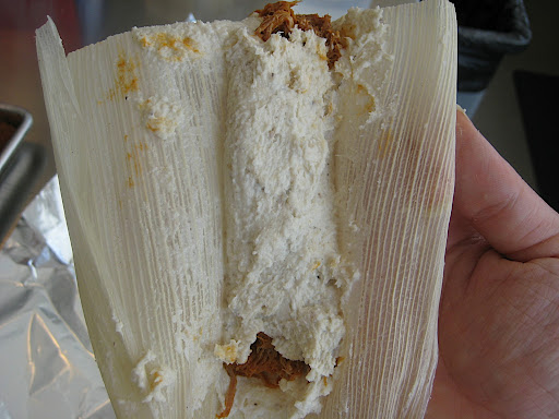 Repeat with the other side so the filling is encased in a cylinder of dough