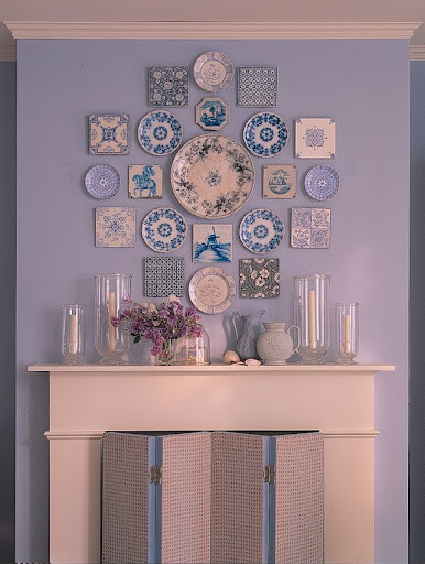 A collection of Delft tiles and transferware plates brings together a range of blues and patterns. A collection of Delft tiles and transferware plates brings together a range of blues and patterns.