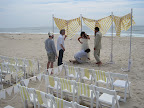 Katie fixing Ashley's dress for the barefoot wedding.
